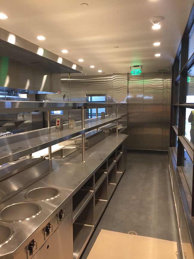 Fully custom chefs counter assembly with pass shelves and remote refrigeration