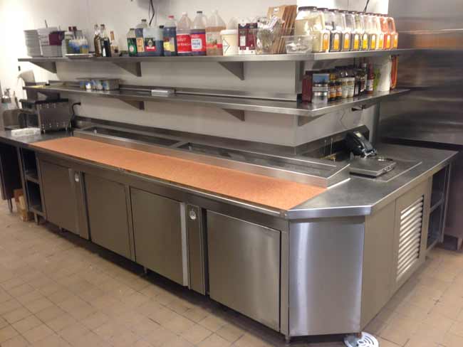 L shaped stainless steel pizza prep counter with pan chiller and custom refer base
