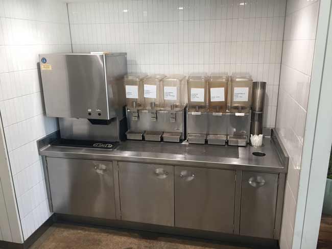 Stainless steel beverage counter with punched out handles on doors