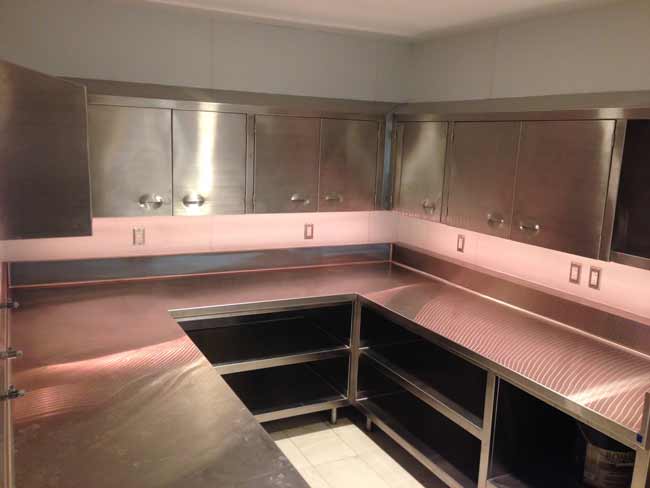 Welded in place wrap around stainless steel work area